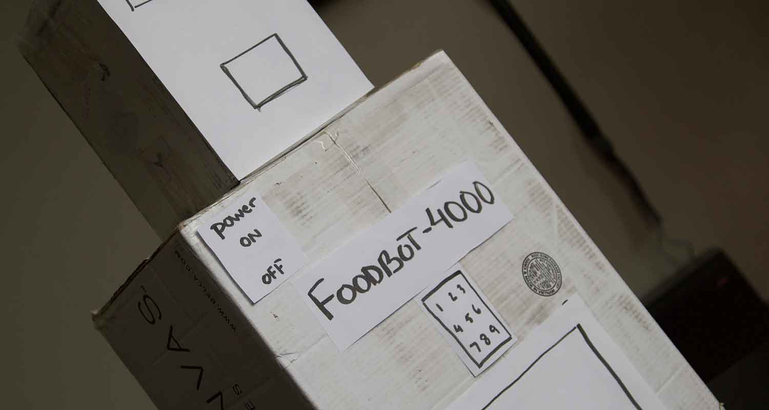 A proud Foodbot-4000 looks over the office after a successful afternoon. (Photo: Alexander Glass)