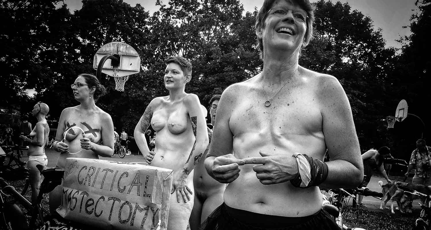 Barbara Grover stands with Critical Mastectomy, the group she organized to ride in the World Naked Bike Ride." photographer="Jan Sonnenmair" alt="Barbara Grover stands with Critical Mastectomy, the group she organized to ride in the World Naked Bike Ride. (Photo: Jan Sonnenmair)
